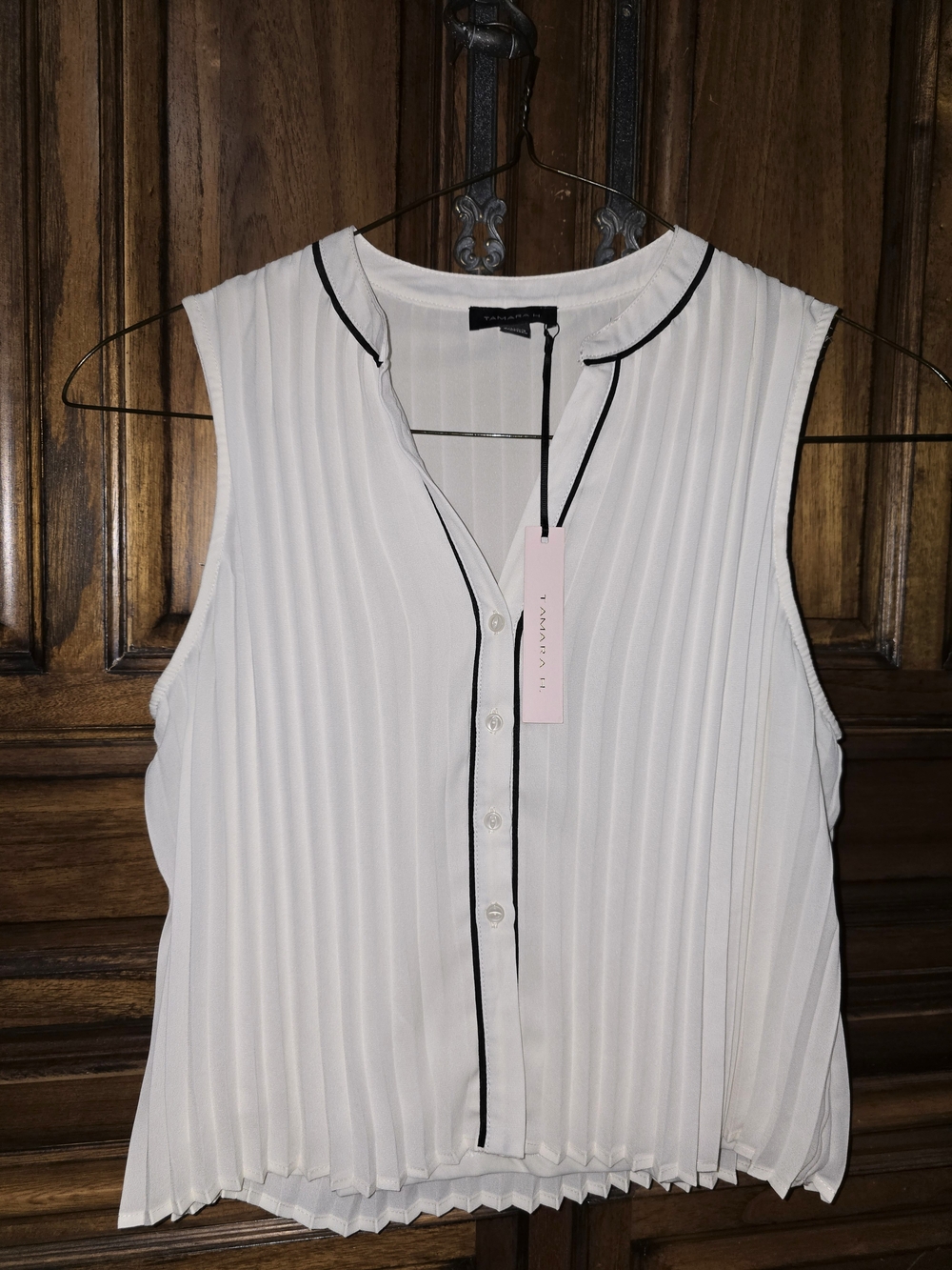 Sleeveless White Pleated Blouse with Black Trim